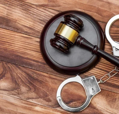handcuffs next to a gavel